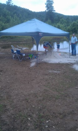 Each summer dad would have sevreal loads of sand hauled in to his spring fed pond to create "Papa' beach". The boys would spend hours playing in the sand and the best part for dad was that he didn't have to go all the way to Florida. 